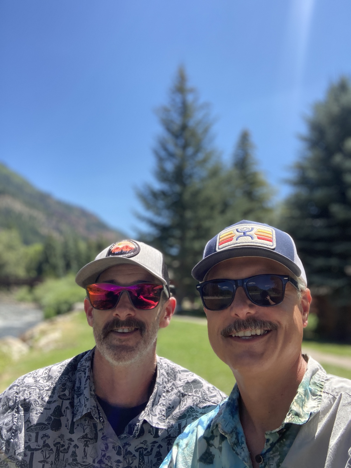 Lin and Mike smiling together outdoors in Colorado